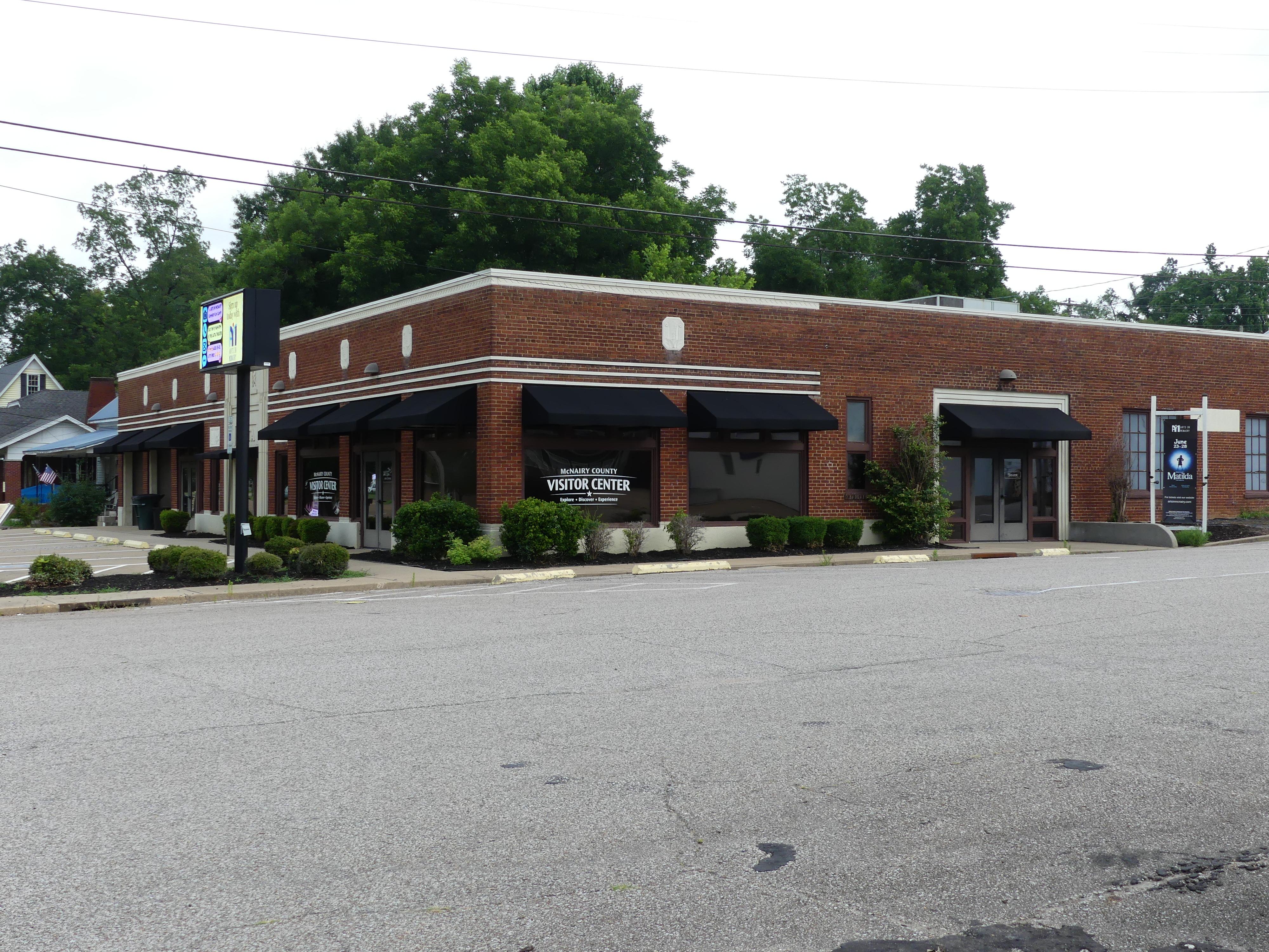 Corner view of the Latta Building in Selmer with new signage